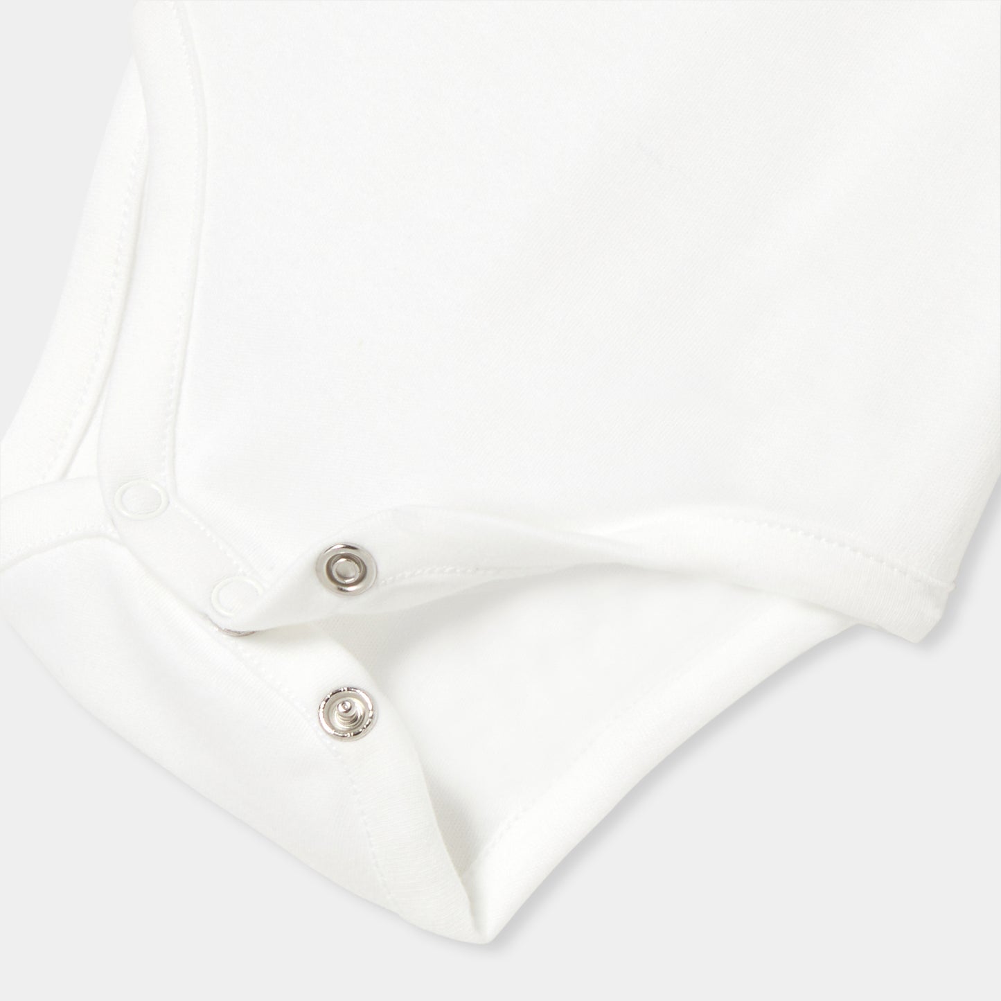 手刺しゅう入り長袖ボディスーツ