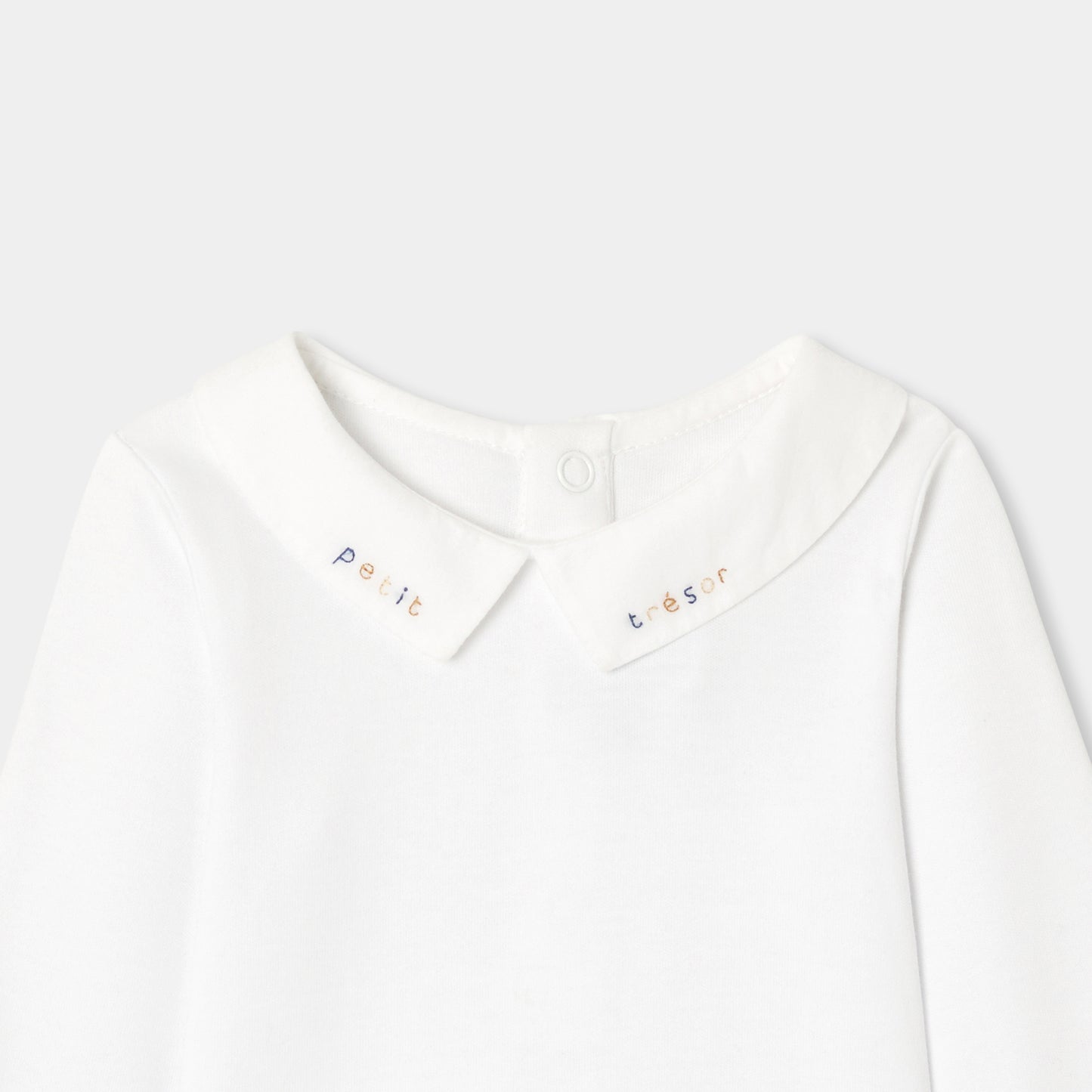 手刺しゅう入り長袖ボディスーツ